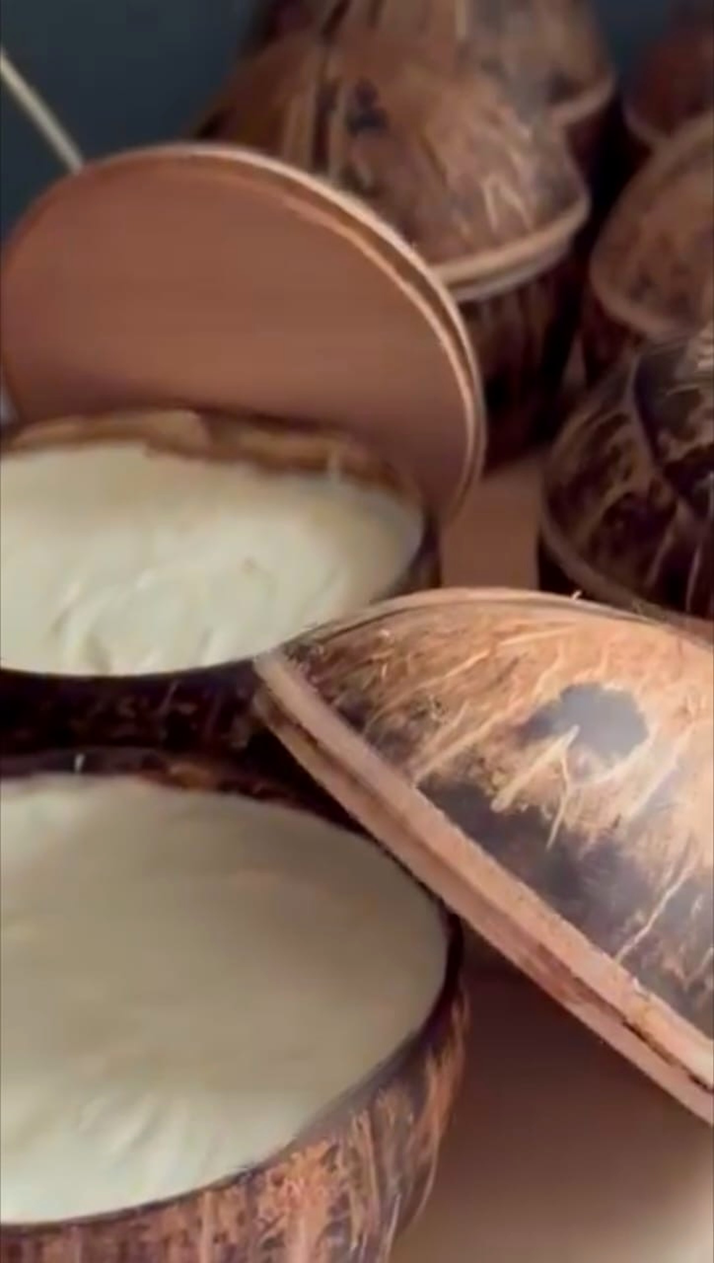 Open BOKOO coconut-shell bowl filled with ivory whipped shea butter